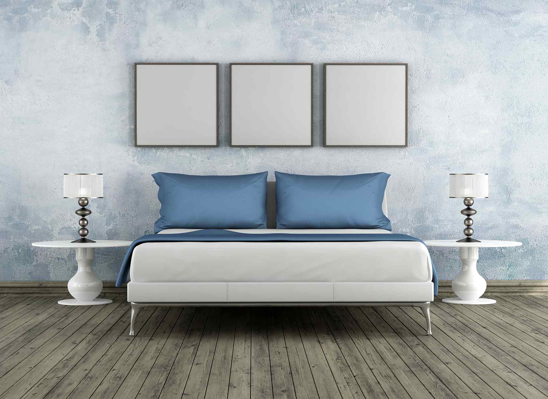 a bedroom with light blue walls