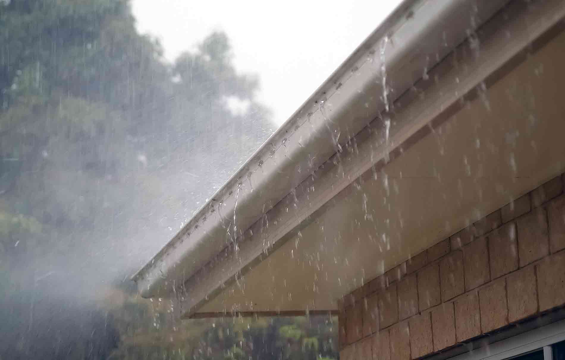 gutters overflowing with rain water