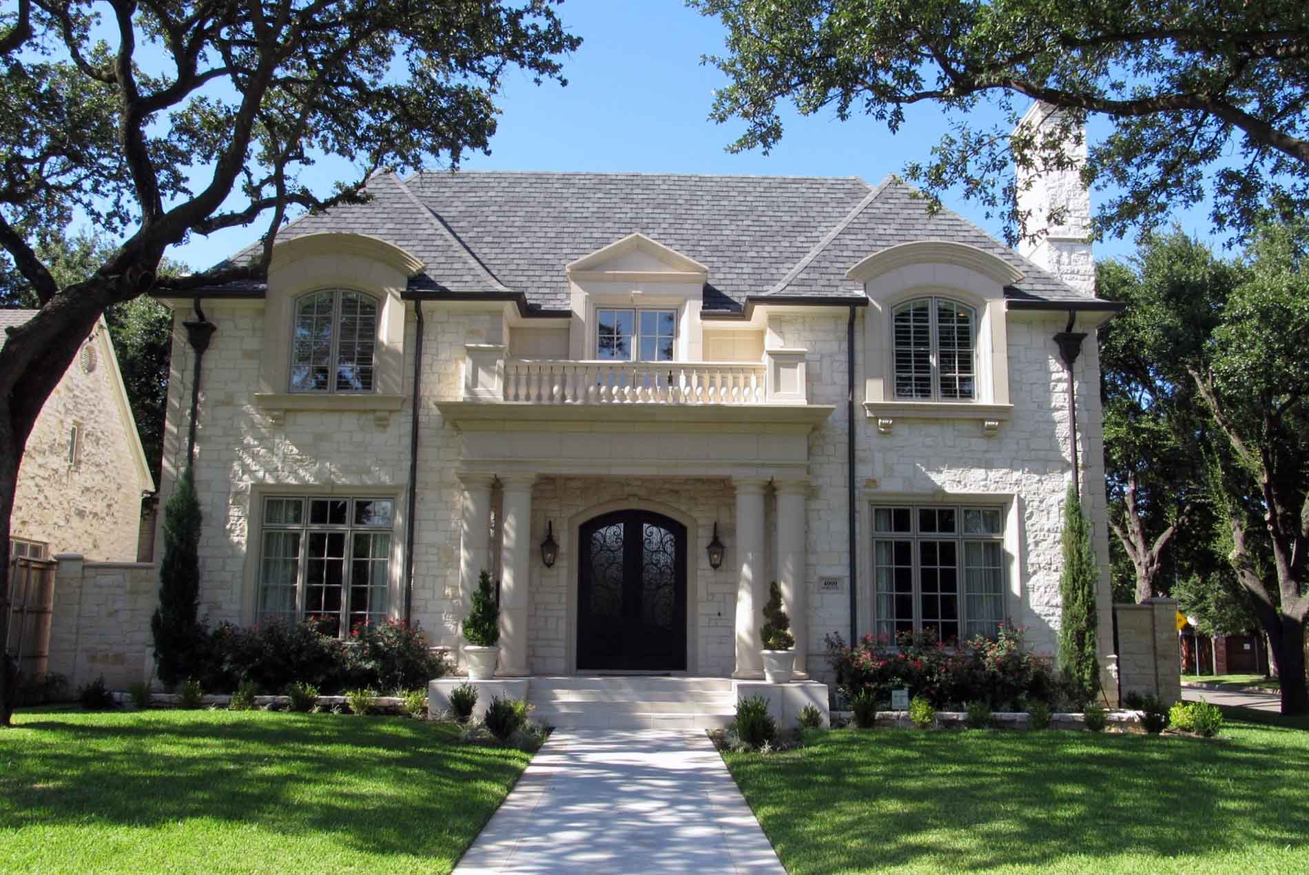 brick home with nice landscaping