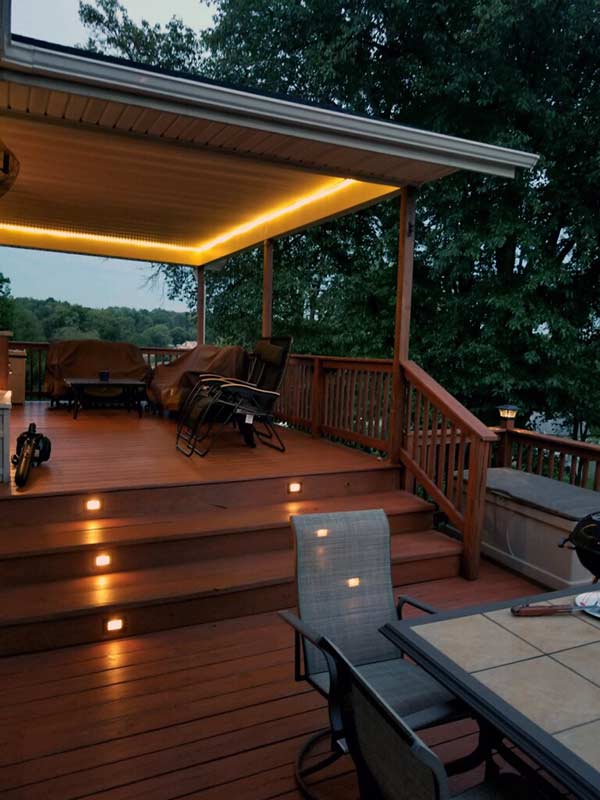 multi-level deck with furniture and table