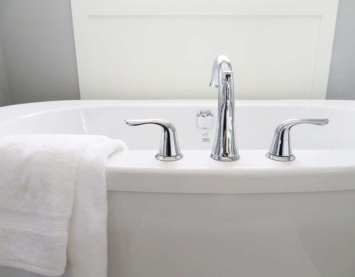 White bathtub with chrome faucet