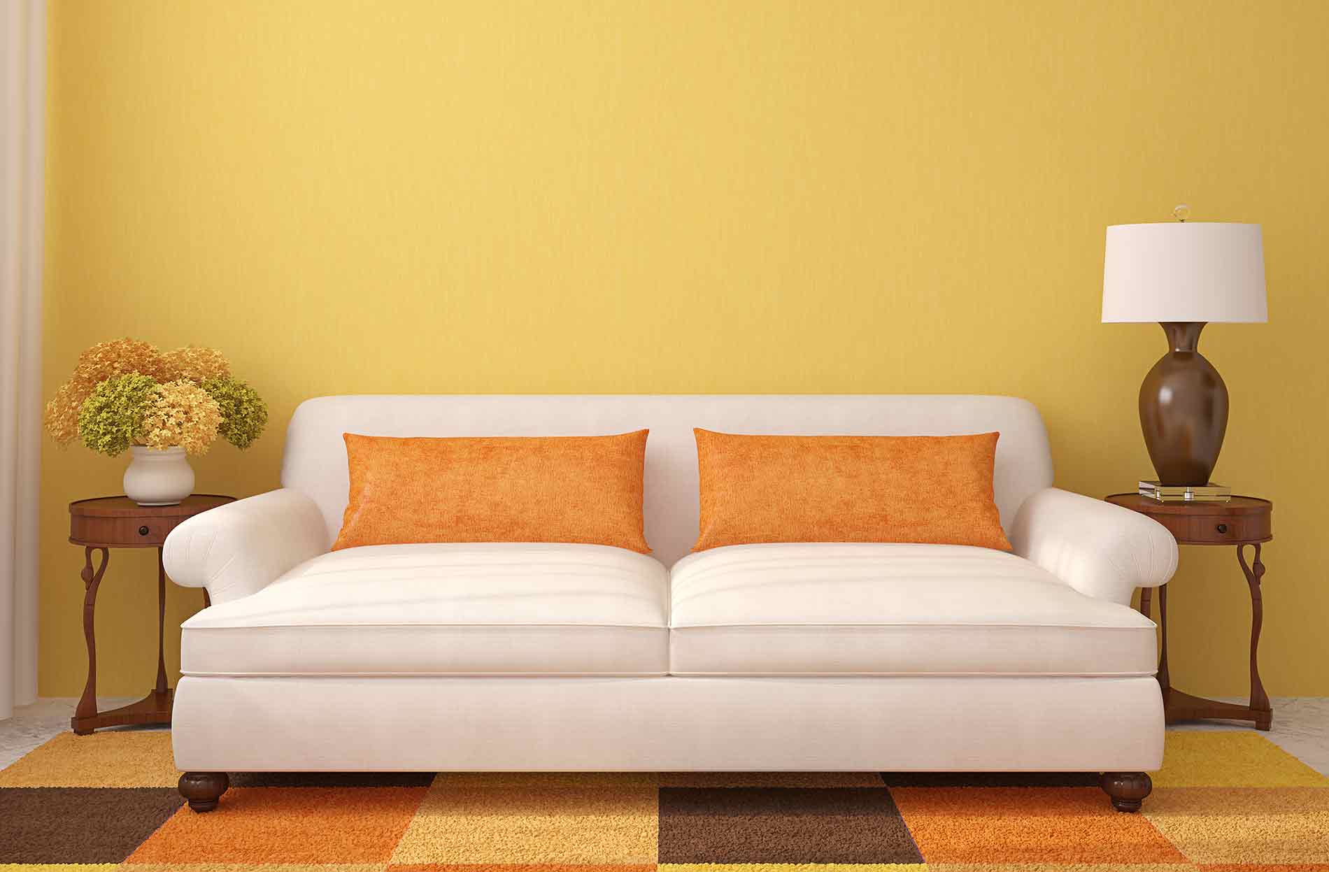 yellow wall with white couch